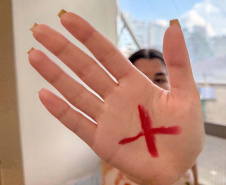 Sinal silencioso que salva vidas integra ação da Segurança Pública no Mês da Mulher